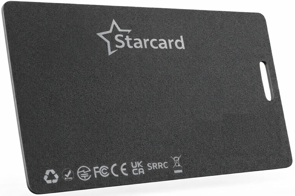 A rectangular black card labeled Starcard with various certification symbols and recycling logos at the bottom, and a slot on one edge, positioned against a white background.