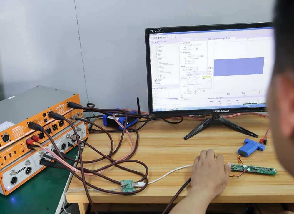 Circuit boards connected to functional electrical test equipment at an engineering bench
